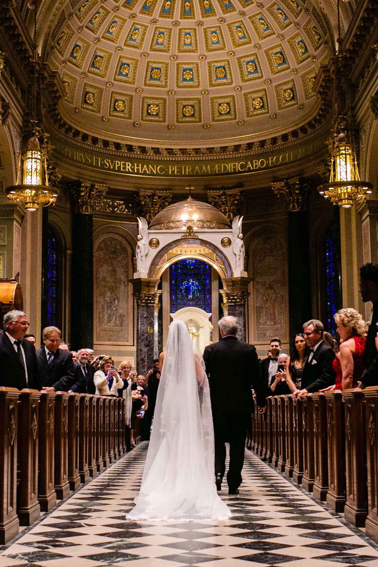 ceremony at cathedral basilica of saints peter and paul bride down the aisle