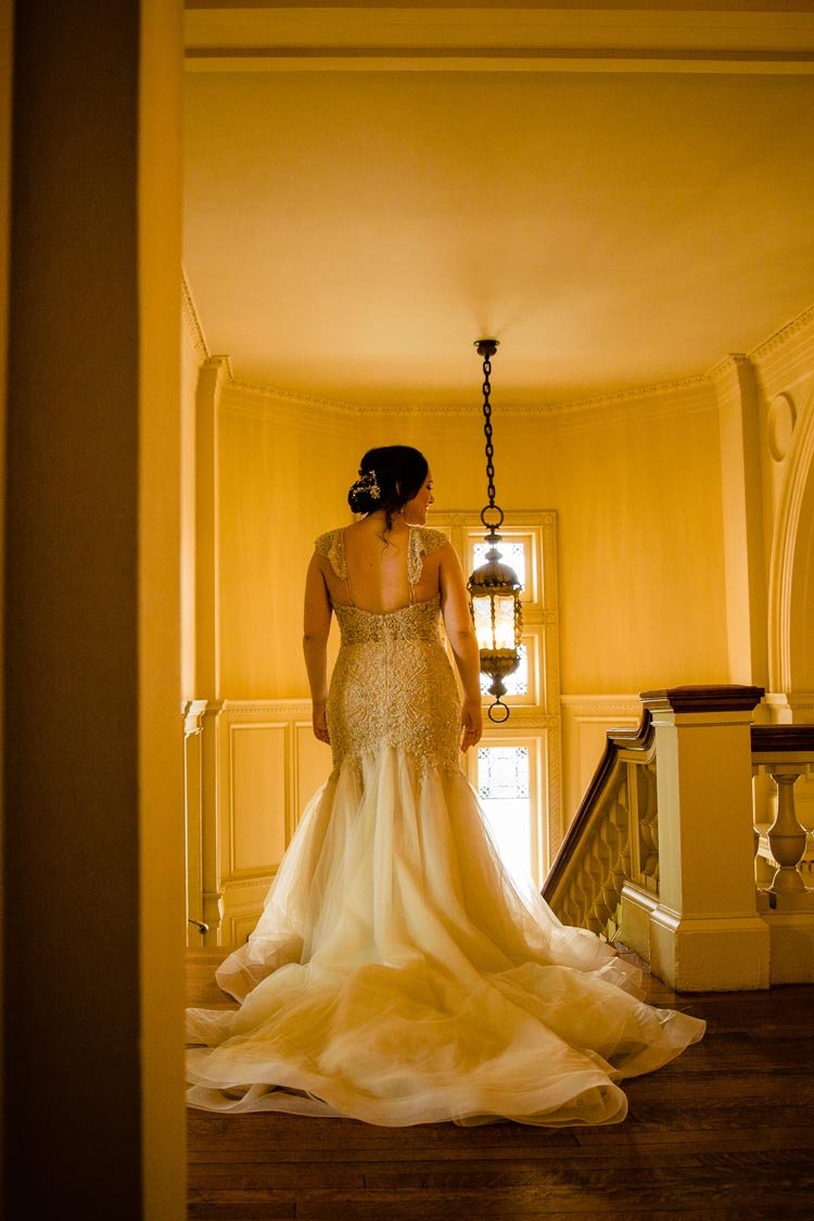 brides on the grand staircase at cairnwood estate