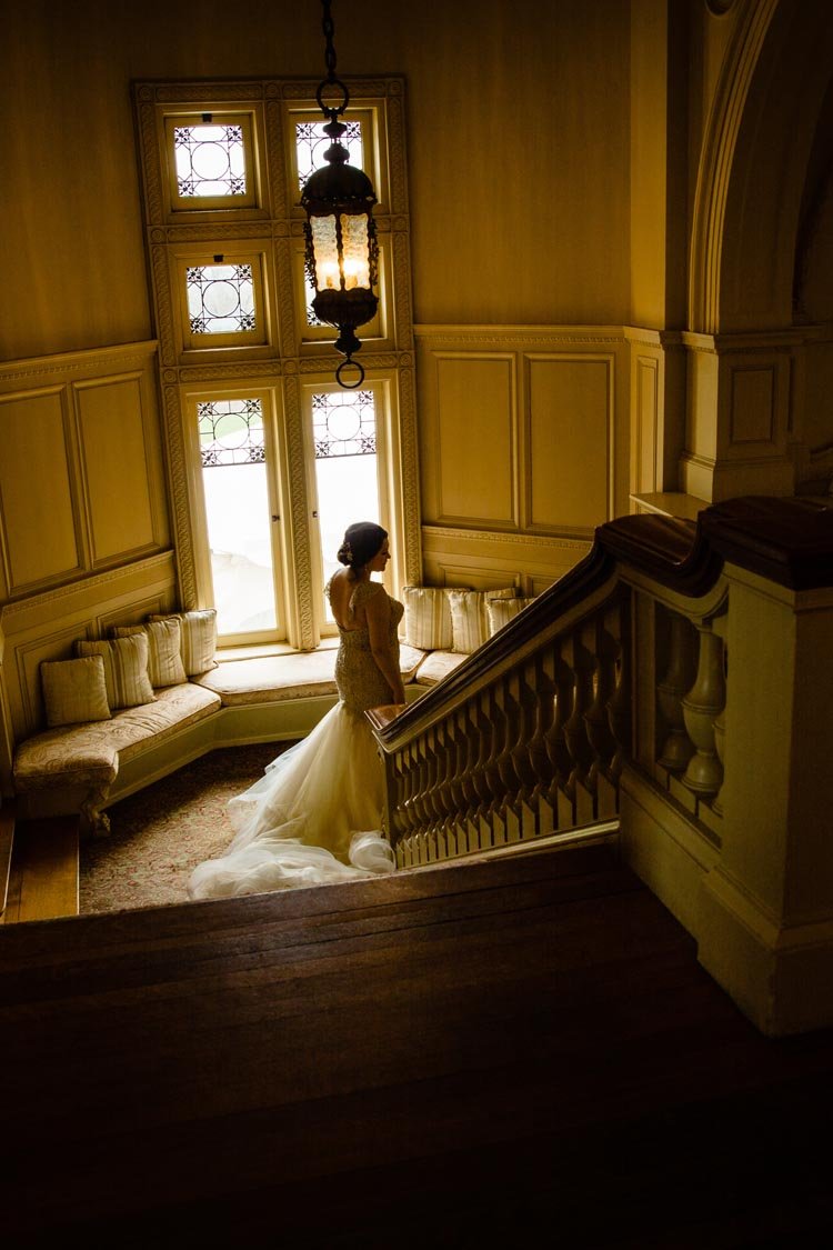 brides on the grand staircase at cairnwood estate