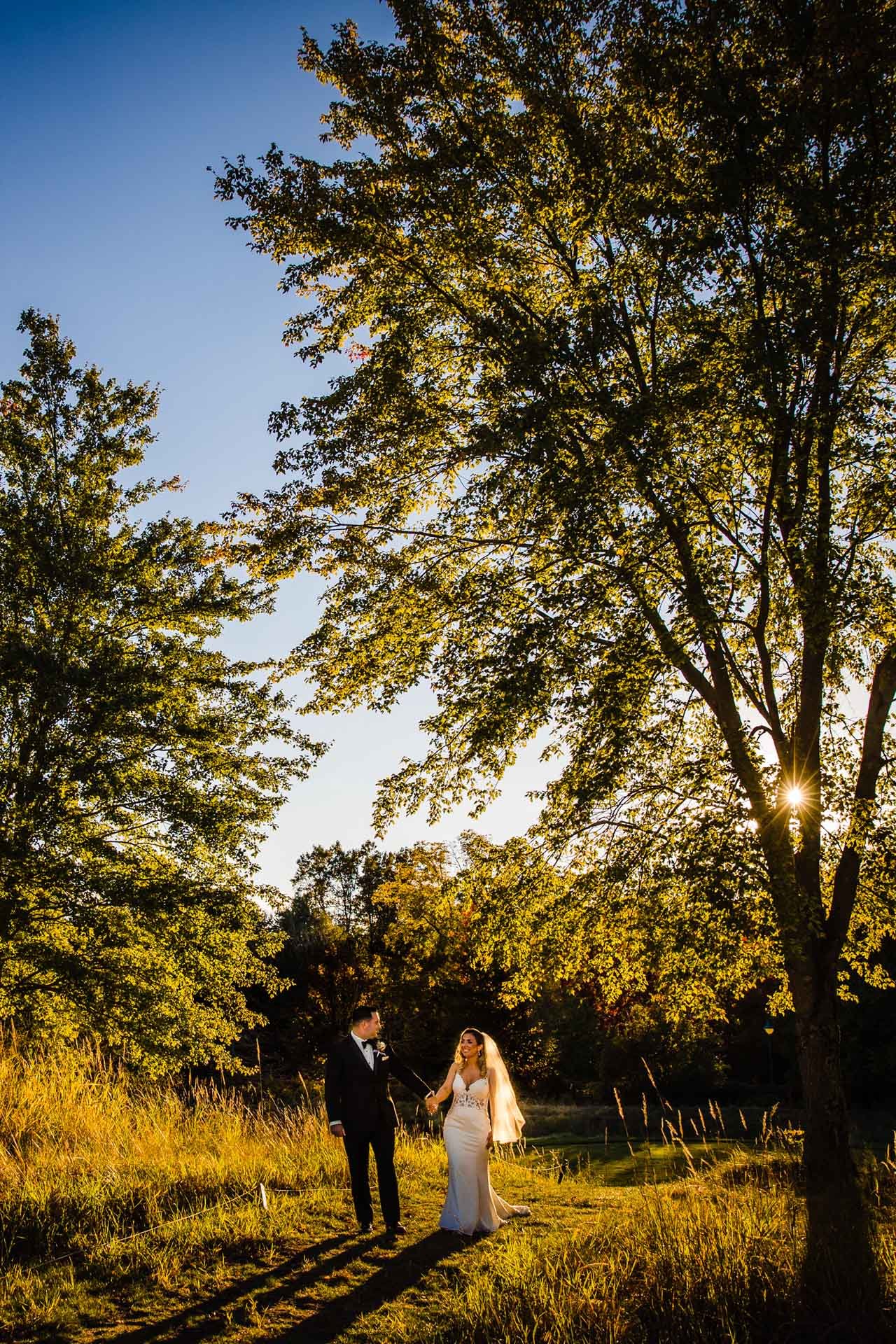 jericho national golf club wedding photographer walking couple